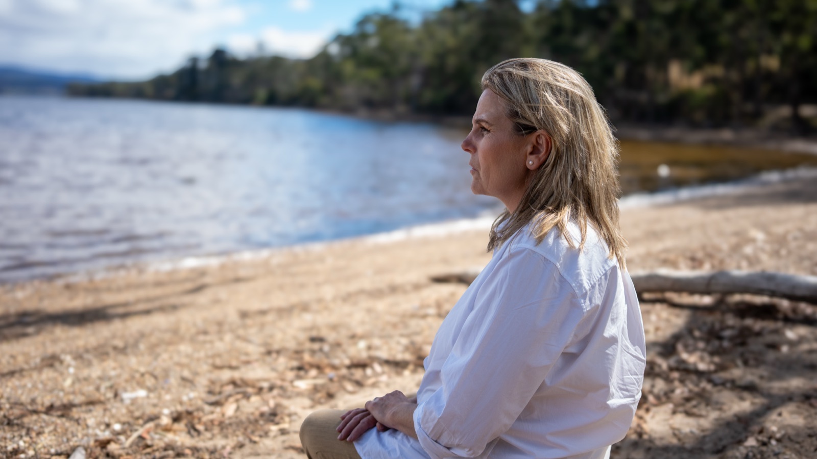 Annica Larsdotter in profile, looking out across the water